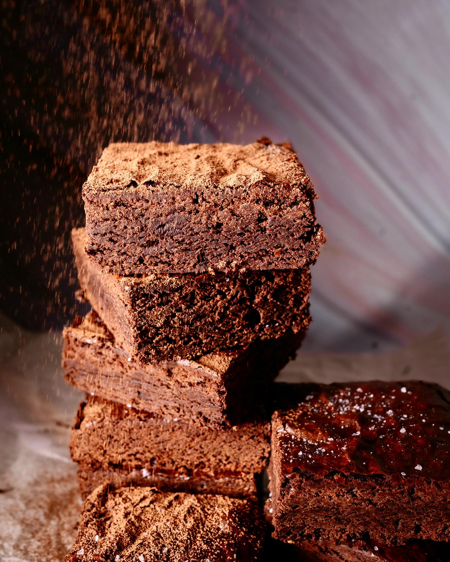 Claro Bakehouse crinkle-top fudge brownies, dusted with cocoa